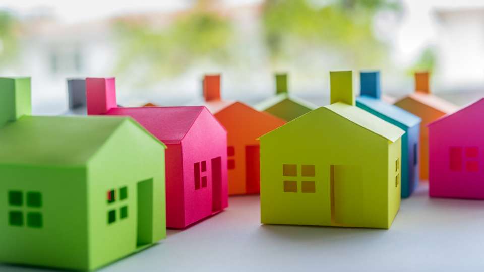 Group of multicolored houses on sale
