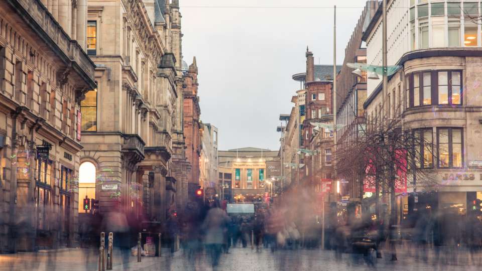 Blurred shoppers and commuters in Glasgow